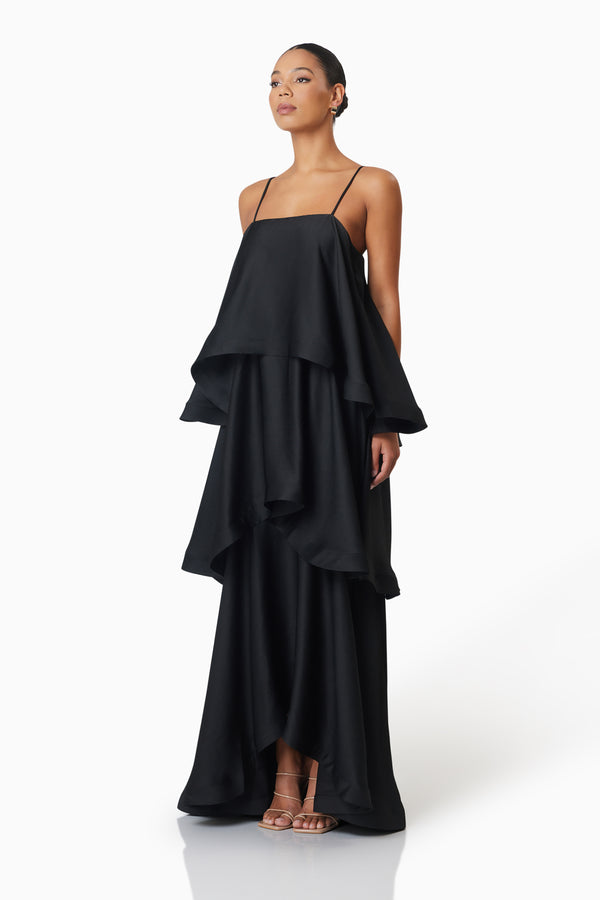 model wearing Tilly Tiered Maxi Dress in Black side shot