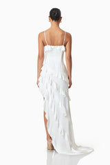 model wearing Kyla Asymmetrical Maxi Dress in White back shot