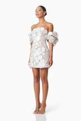 model wearing Perry Embellished Mini Dress in White side shot
