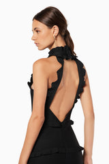 model wearing Theatrical high neckline maxi gown in black back shot