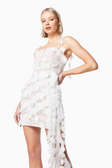 blonde model wearing ISLES 3D ROSETTE MINI DRESS IN WHITE close up shot