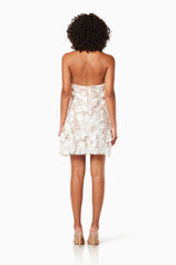 model wearing Callista floral 3D mini dress in ivory back shot