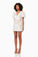 model wearing Zayla 3D floral mini dress in white side shot