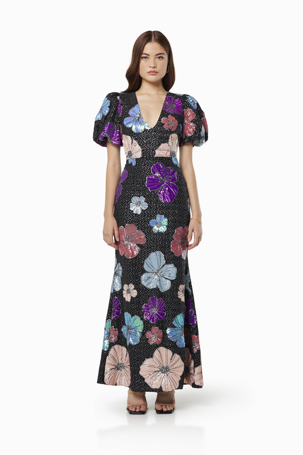 Model wearing MINKA FLORAL SEQUIN MAXI GOWN IN MULTI front shot