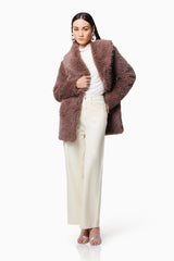 Brunette model wearing WYOMING FAUX FUR COAT IN BROWN close up shot