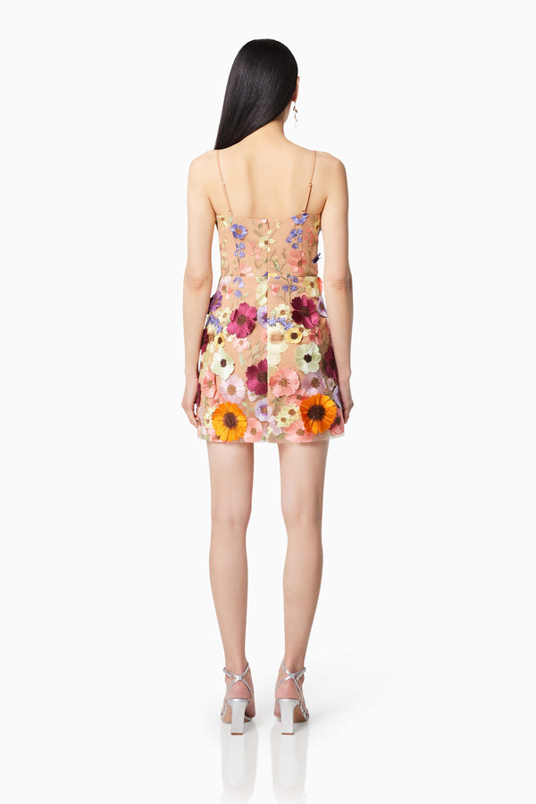 model wearing Arabella floral mini dress in multi back shot