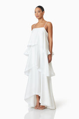 model wearing Tilly Tiered Maxi Dress in White side shot