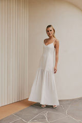 Blonde Model wearing CURAAE Palm Drop Waist Frill Summer Maxi Dress In White front shot