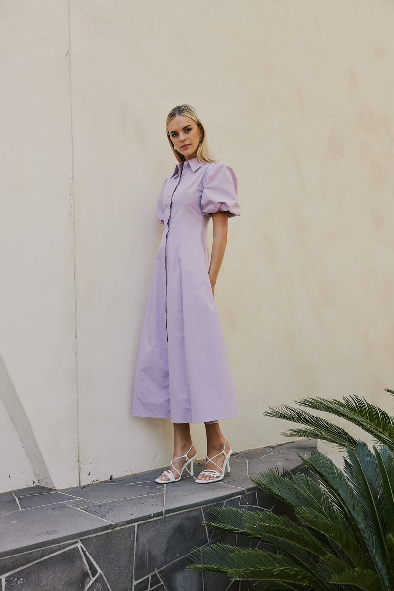 blonde model wears CURAAE Bay Midi Shirt Puff Sleeve A Line Dress In Lilac front shot