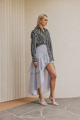 blonde model wears CURAAE Azalea Oversized Contract Stripe Loose Shirt In Black & White side shot