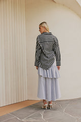 blonde model wears CURAAE Azalea Oversized Contract Stripe Loose Shirt In Black & White back shot