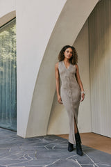 Model wearing CURAAE Zoey Ribbed V Neck Braided Knit Sleeveless Midi Dress In Tan front shot 