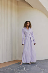 brunette model wears CURAAE Jasmine Maxi Shirt Tie A Line Dress In Lilac Stripe front shot