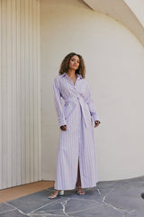 brunette model wears CURAAE Jasmine Maxi Shirt Tie A Line Dress In Lilac Stripe front shot