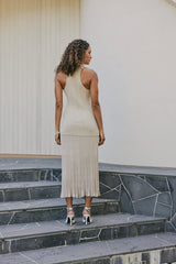 Model wearing CURAAE Savannah Ribbed High Neck Sleeveless Knit Set In Beige back shot 