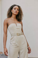 Model wearing Seraphina Pinstripe Jumpsuit In Beige close shot 