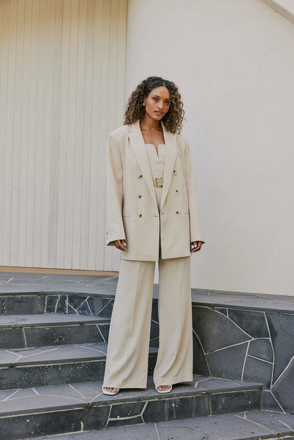 Model wearing Lyric Oversized Pinstripe Blazer In Beige front shot 