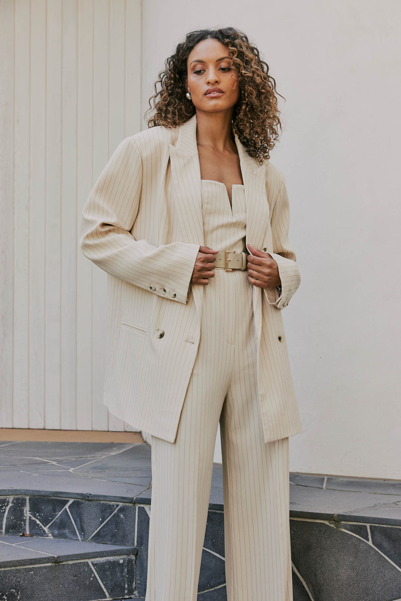 Model wearing Lyric Oversized Pinstripe Blazer In Beige close shot