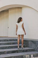 Model wearing Seren Flap Mini Dress In White back shot