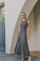 Model wearing Celeste Sleeveless Midi Dress In Stone Gray movement shot