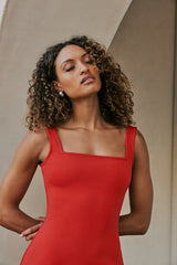 model wearing CURAEE Mia Midi Dress In Cherry Red close up shot