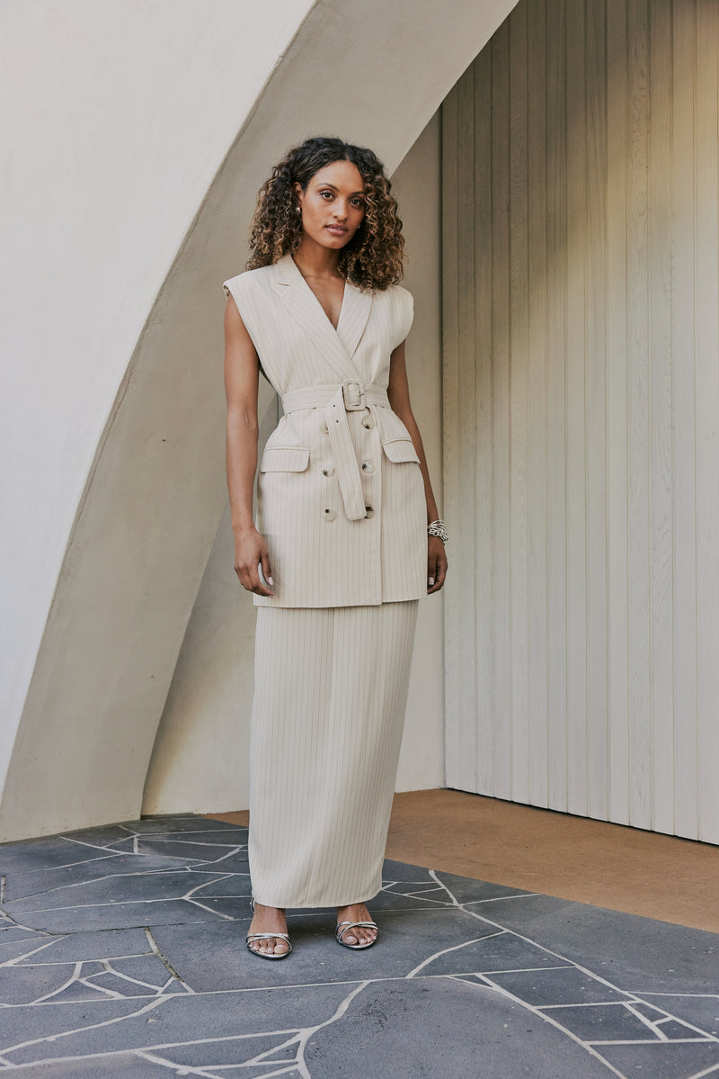  model is wearing Solene Vest Pinstripe Mini Dress in Beige front shot