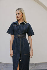 blonde model wears CURAAE Elysia Midi Shirt Belt Denim Dress In Ink close up shot