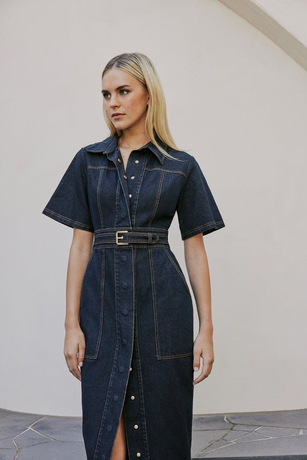 blonde model wears CURAAE Elysia Midi Shirt Belt Denim Dress In Ink close up shot 