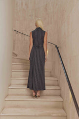 Blonde model wears Tiffany Maxi Sleeveless Dress back shot