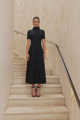 Brunette model wears Oscar Short Sleeve Midi Dress in Black front shot