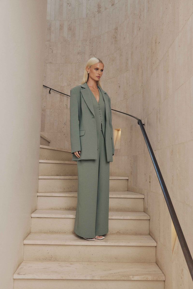 Blonde model wears Antara Oversized Blazer in Green side shot