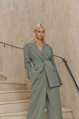 Blonde model wears Antara Oversized Blazer in Green close shot