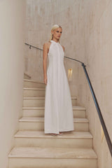 Blonde model wears Chelsea Sleeveless Maxi Dress in White side shot