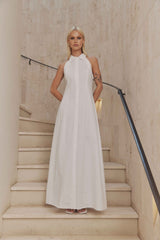 Blonde model wears Chelsea Sleeveless Maxi Dress in White front shot