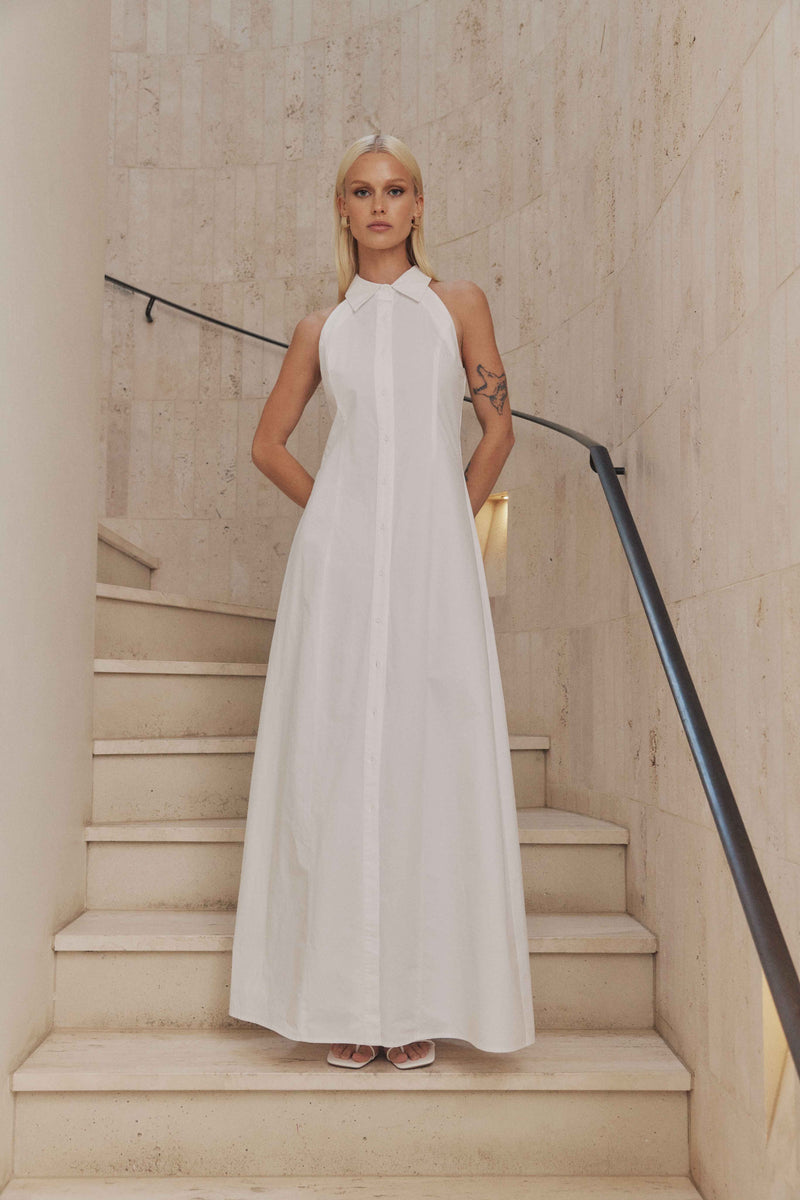 Blonde model wears Chelsea Sleeveless Maxi Dress in White front shot