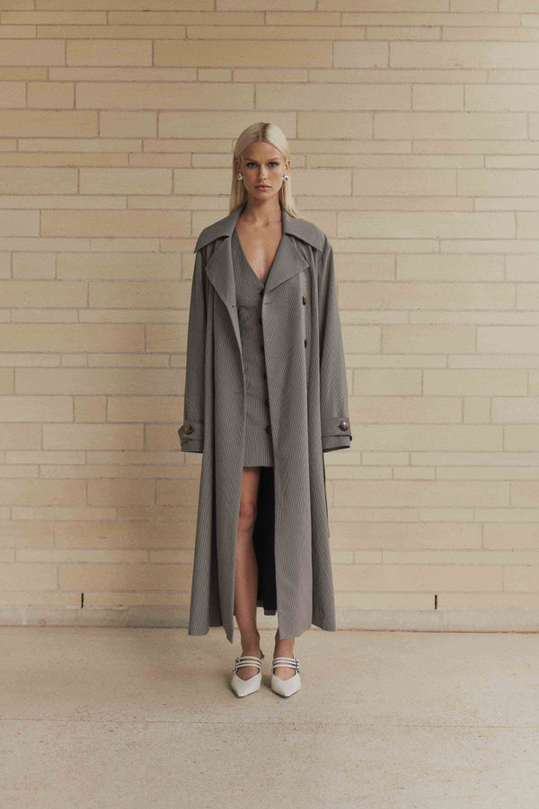 Blonde model wearing London Trench Coat In Brown front shot