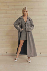 Blonde model wearing London Trench Coat In Brown posed shot