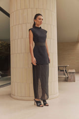 Brunette model wears Bond Sleeveless Mesh Maxi Dress in Black side shot