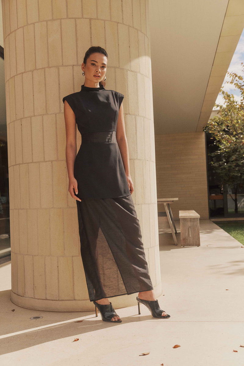 Brunette model wears Bond Sleeveless Mesh Maxi Dress in Black front shot