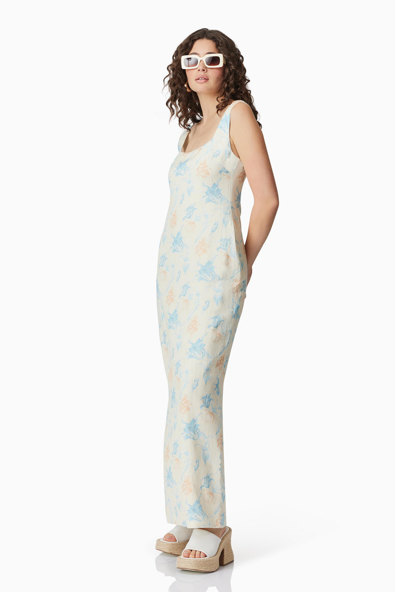 Brunette model wearing Esther Floral Maxi Dress side shot