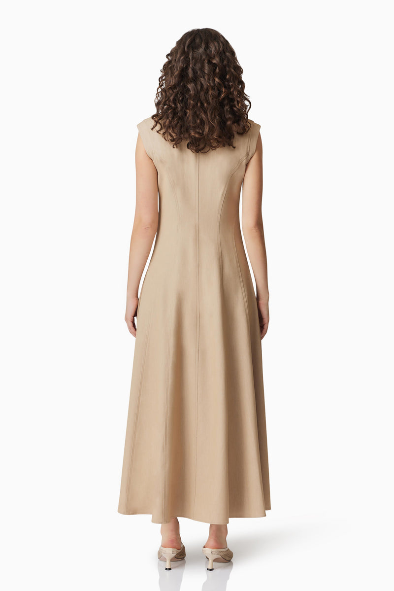 Brunette model wearing Gabriella Midi Dress In Beige back shot