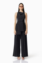 Brunette model wearing Noa Pleated Trousers in Black front shot