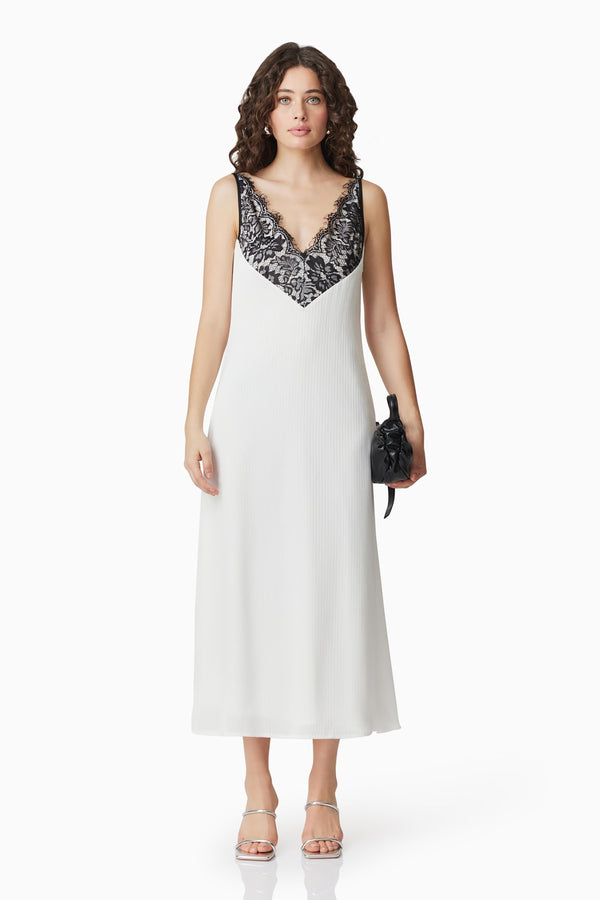 Brunette model wearing Valentina Lace Midi Dress In White front shot