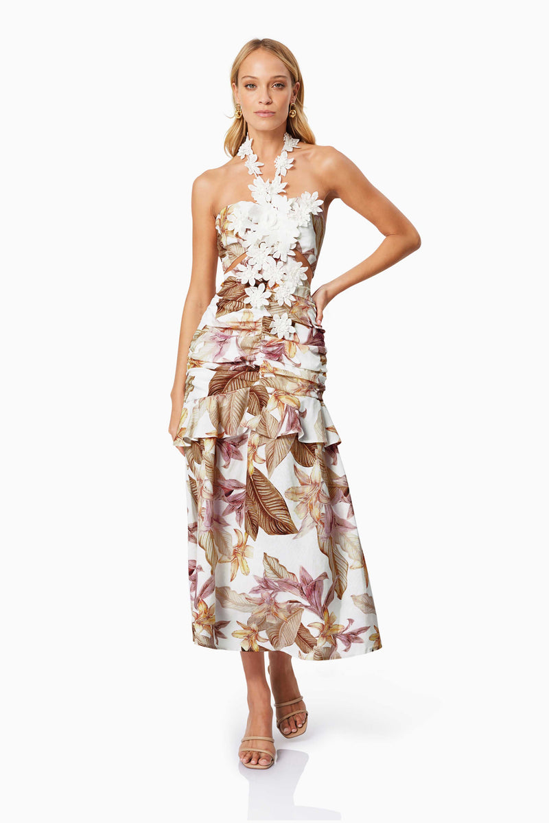 Blonde model wearing MEADOW FLORAL COCKTAIL DRESS IN MULTI front shot