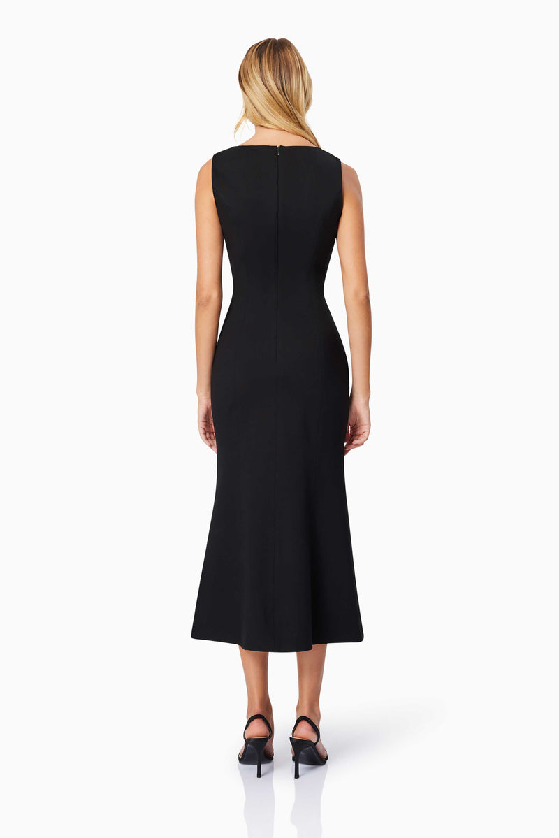 Blonde model wearing Eden Midi Dress in Black back shot