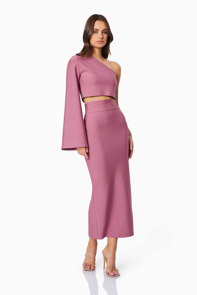 Brunette model wearing Vera Midi Set in Pink side shot