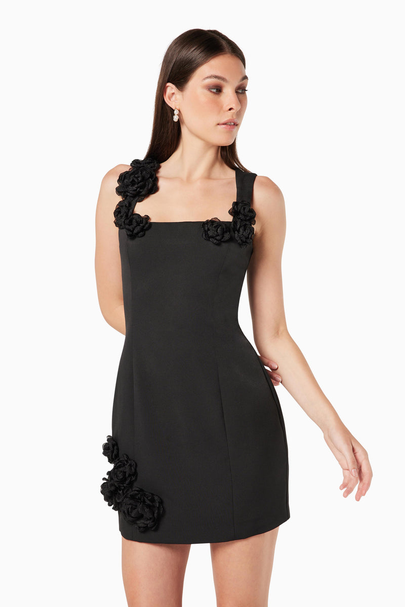 model wearing Trompe 3D floral mini dress in black close up shot