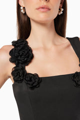 model wearing Trompe 3D floral mini dress in black close up shot