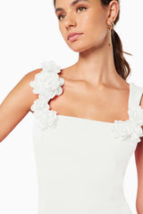 model wearing TROMPE 3D FLORAL MINI DRESS IN WHITE close up shot