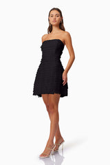 model wearing Hailey Strapless Mini Party Dress In Black side shot